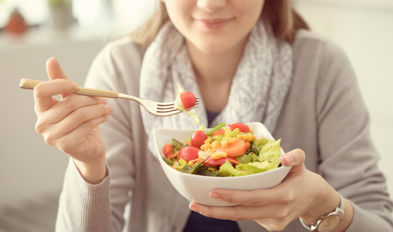 woman eating healthy salad